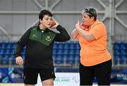 16 November 2024; James Egan from Ferbane, Offaly, tries out shot put with the help of VI Para Hub coordinator Tracey Percy during the PTSB NextGen Community Series at the National Indoor Arena on the Sport Ireland Campus in Dublin. Paralympics Ireland hosted the latest in the PTSB NextGen Community Series at the Sport Ireland National Indoor Arena on Saturday. This programme is open to people over 10 with a visual, intellectual, or physical impairment, allowing them to ‘come and try’ Para sports and learn about opportunities in their local areas. Photo by Seb Daly/Sportsfile