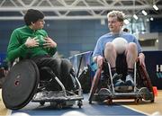 16 November 2024; Stevie Kane, right, tries out wheelchair rugby with the help of Ireland wheelchair rugby international Chris Meneilly during the PTSB NextGen Community Series at the National Indoor Arena on the Sport Ireland Campus in Dublin. Paralympics Ireland hosted the latest in the PTSB NextGen Community Series at the Sport Ireland National Indoor Arena on Saturday. This programme is open to people over 10 with a visual, intellectual, or physical impairment, allowing them to ‘come and try’ Para sports and learn about opportunities in their local areas. Photo by Seb Daly/Sportsfile