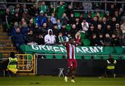 16 November 2024; Frantz Pierrot of Drogheda United celebrates after scoring his side's third goal, in front of the Bray Wanderers supporters, during the SSE Airtricity Men's Premier Division Promotion / Relegation Play-Off match between Bray Wanderers and Drogheda United at Tallaght Stadium in Dublin. Photo by Ben McShane/Sportsfile