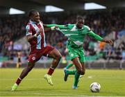 16 November 2024; Frantz Pierrot of Drogheda United in action against Cole Omorehiomwan of Bray Wanderers during the SSE Airtricity Men's Premier Division Promotion / Relegation Play-Off match between Bray Wanderers and Drogheda United at Tallaght Stadium in Dublin. Photo by Thomas Flinkow/Sportsfile