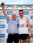 17 November 2024; Keelan Kilrehill of Moy Valley AC, Mayo, on the podium with his Dad, Brendan, after winning the Senior Men's race during the 123.ie National Senior, Junior and Juvenile Even Age Cross Country Championships at Castle Irvine Estate in Irvinestown, Fermanagh. Photo by Ramsey Cardy/Sportsfile