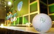 25 August 2004; A ball carrying the new FAI  logo sits on the stage as models display some of the new merchandise, at the launch of the Association's new logo, website, fans club and range of merchandise in Jury's Hotel, Dublin. Picture credit; Brian Lawless / SPORTSFILE