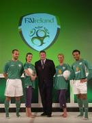 25 August 2004; Fran Rooney, CEO, FAI, with models left to right, Justin Manville, Karen Fitzpatrick, Katy French and Emy Onyesoh at the launch of the Association's new logo, website, fans club and range of merchandise in Jury's Hotel, Dublin. Picture credit; Ray McManus / SPORTSFILE