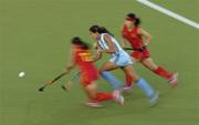 26 August 2004; Luciana Aymar, Argentina, goes past Zhou Wangfeng, left, and Ma Yibo, China, on her way to score her sides winning goal. Bronze Medal Match, Argentina v China, Olympic Hockey Centre, Helliniko Sports Complex. Games of the XXVIII Olympiad, Athens Summer Olympics Games 2004, Athens, Greece. Picture credit; Brendan Moran / SPORTSFILE