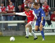 27 August 2004; Mark Quinless, St. Patrick's Athletic, in action against Daryl Murphy, Waterford United. eircom league, Premier Division, St. Patrick's Athletic v Waterford United, Richmond Park, Dublin. Picture credit; Brian Lawless / SPORTSFILE