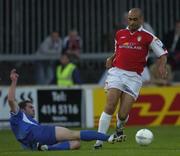 27 August 2004; Paul Osam, St. Patrick's Athletic, in action against David Mulcahy, Waterford United. eircom league, Premier Division, St. Patrick's Athletic v Waterford United, Richmond Park, Dublin. Picture credit; Brian Lawless / SPORTSFILE