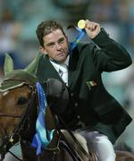 27 August 2004; Ireland's Cian O'Connor with his Gold Medal after winning the Individual Jumping Competition on Waterford Crystal. Markopoulo Olympic Equestrian Centre. Games of the XXVIII Olympiad, Athens Summer Olympics Games 2004, Athens, Greece. Picture credit; Brendan Moran / SPORTSFILE