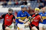 28 August 2004; Pat Buckley, Tipperary, in action against Paddy Hughes, right, and Kieran Coulter, Down. Erin All-Ireland U21 Hurling Championship Semi-Final, Tipperary v Down, O'Moore Park, Portlaoise, Co. Laois.  Picture credit; Matt Browne / SPORTSFILE