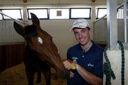 28 August 2004; Ireland's Cian O'Connor with Waterford Crystal and the Gold Medal that they won in the Individual Jumping Competition. Markopoulo Olympic Equestrian Centre. Games of the XXVIII Olympiad, Athens Summer Olympics Games 2004, Athens, Greece. POOL PHOTO SPORTSFILE