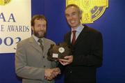 28 August 2004; GAA President Sean Kelly presents the GAA MacNamee Award 2003 for the 'Best County Final Programme' to Tommy O'Connor. Burlington Hotel, Dublin  Picture credit; Ray McManus / SPORTSFILE