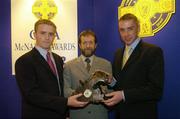 28 August 2004; GAA President Sean Kelly presents the GAA MacNamee Award 2003 for the 'Best Website' to Tony Nulty and David Leydon of Castleknock GAA Club. Burlington Hotel, Dublin  Picture credit; Ray McManus / SPORTSFILE