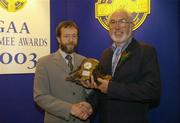 28 August 2004; GAA President Sean Kelly presents the GAA MacNamee Award 2003 for the 'Best Club Media Production' to Declan Feore of CLG Naomh Jude. Burlington Hotel, Dublin  Picture credit; Ray McManus / SPORTSFILE