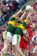 29 August 2004; Niall Mc Cusker, Derry, in action against Colm Cooper and Dara O Cinneide, Kerry. Bank of Ireland Senior Football Championship Semi-Final, Derry v Kerry, Croke Park, Dublin. Picture credit; Ray McManus / SPORTSFILE