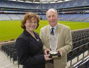 30 August 2004; Elizabeth Reynolds, Marketing Director, Lucozade Sport, with Sean O'Laoire, who accepted the award on behalf of Clare who won the award for hurling. Croke Park, Dublin. Picture credit; Ray McManus / SPORTSFILE