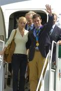 30 August 2004; Olympic gold medalist Cian O'Connor with girlfriend Rachel Wise on the arrival home of the Irish Olympic team from Athens. Dublin Airport, Dublin. Picture credit; Pat Murphy / SPORTSFILE