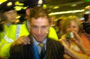 30 August 2004; Olympic gold medalist Cian O'Connor makes his way through the crowd of supporters on the arrival home of the Irish Olympic team from Athens. Dublin Airport, Dublin. Picture credit; Pat Murphy / SPORTSFILE