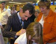 30 August 2004; Irish equestrian athlete Kevin Babbington signs autographs on the arrival home of the Irish Olympic team from Athens. Dublin Airport, Dublin. Picture credit; Pat Murphy / SPORTSFILE