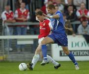 27 August 2004; Mark Quinnless, St. Patrick's Athletic, in action against Kevin O'Brien, Waterford United. eircom league, Premier Division, St. Patrick's Athletic v Waterford United, Richmond Park, Dublin. Picture credit; Brian Lawless / SPORTSFILE