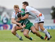 28 September 2013; Robbie Henshaw, Connacht, is tackled by Jonathan Spratt, left, and Dan Biggar, Ospreys. Celtic League 2013/14, Round 4, Connacht v Ospreys, Sportsground, Galway. Picture credit: Oliver McVeigh / SPORTSFILE