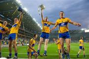 28 September 2013; Clare players, from left, Seadna Morey, Conor Ryan, Tony Kelly and John Conlon celebrate with the Liam MacCarthy Cup after the game. GAA Hurling All-Ireland Senior Championship Final Replay, Cork v Clare, Croke Park, Dublin. Picture credit: Brendan Moran / SPORTSFILE