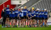 17 November 2024; Sarsfields manager Johnny Crowley, left, and his players stand for Amhrán na bhFiann before the AIB Munster GAA Senior Club Hurling Championship semi-final match between Sarsfields and Feakle at Supervalu Páirc Uí Chaoimh in Cork. Photo by Brendan Moran/Sportsfile