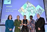 20 November 2024; Olympians Sophie Becker, second from left, and Kelly McGrory, third from left, and Adewumi Adeleke, mother of Rhasidat Adeleke fourth from left,, are presented with their Team of the year awards on behalf of the Women 4x400m relay team by Athletics Ireland President John Cronin, far right, and 123.ie Managing Director Elaine Robinson, far left,  during the 123.ie National Athletics Awards ceremony at the Crowne Plaza Hotel in Santry, Dublin. A full list of winners from the event can be found at AthleticsIreland.ie Photo by Sam Barnes/Sportsfile