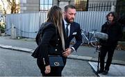 22 November 2024; Mr Conor McGregor and his partner Dee Devlin arrive for the civil action case, P Ní Laimhin v McGregor & Anor, in High Court 24 at Chancery Place in Dublin. Photo by David Fitzgerald/Sportsfile