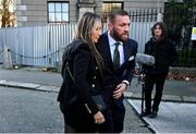 22 November 2024; Mr Conor McGregor and his partner Dee Devlin arrive for the civil action case, P Ní Laimhin v McGregor & Anor, in High Court 24 at Chancery Place in Dublin. Photo by David Fitzgerald/Sportsfile
