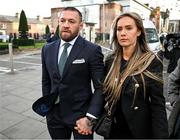 22 November 2024; Mr Conor McGregor, with his partner Dee Devlin leave the court, as the court breaks for the jury’s decision in the civil action case, P Ní Laimhin v McGregor & Anor, in High Court 24 at Chancery Place in Dublin. Photo by David Fitzgerald/Sportsfile