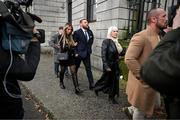 22 November 2024; Mr Conor McGregor, with his partner Dee Devlin, left, and his mother Margaret McGregor leave the court, as the court breaks for the jury’s decision in the civil action case, P Ní Laimhin v McGregor & Anor, in High Court 24 at Chancery Place in Dublin. Photo by David Fitzgerald/Sportsfile