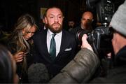 22 November 2024; Mr Conor McGregor leaves court, accompanied by his partner Dee Devlin, after the court announced the jury’s decision in the civil action case, P Ní Laimhin v McGregor & Anor, in High Court 24 at Chancery Place in Dublin. Photo by David Fitzgerald/Sportsfile