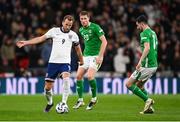 17 November 2024; Harry Kane of England in action against Mark McGuinness and Finn Azaz, right, of Republic of Ireland during the UEFA Nations League B Group 2 match between England and Republic of Ireland at Wembley Stadium in London, England. Photo by Stephen McCarthy/Sportsfile