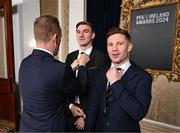 23 November 2024; Shelbourne's Sean Boyd, centre, and techincal director Luke Byrne, right,  have their ties adjusted by PFA Ireland general secretary Stephen McGuinness at the PFA Ireland Awards 2024 at The College Green Hotel in Dublin. Photo by Stephen McCarthy/Sportsfile