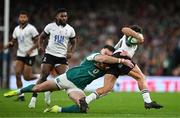 23 November 2024; Jacob Stockdale of Ireland tackles Caleb Muntz of Fiji during the Autumn Nations Series match between Ireland and Fiji at the Aviva Stadium in Dublin. Photo by Brendan Moran/Sportsfile