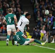 23 November 2024; Kitione Salawa of Fiji is tackled by Sam Prendergast, hidden, and Jacob Stockdale of Ireland which subsequently resulted in a yellow card decision on Sam Prendergast during the Autumn Nations Series match between Ireland and Fiji at the Aviva Stadium in Dublin. Photo by Brendan Moran/Sportsfile