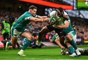 23 November 2024; Jiuta Wainiqolo of Fiji in action against Jacob Stockdale, left, and Tadhg Beirne of Ireland during the Autumn Nations Series match between Ireland and Fiji at the Aviva Stadium in Dublin. Photo by Shauna Clinton/Sportsfile