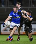 23 November 2024; Jack McCarron of Scotstown in action against Niall Branagan of Kilcoo during the AIB Ulster GAA Senior Club Football Championship semi-final match between Kilcoo and Scotstown at Box-IT Athletic Grounds in Armagh. Photo by Ramsey Cardy/Sportsfile