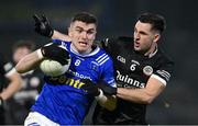 23 November 2024; Mícheál McCarville of Scotstown in action against Darryl Branagan of Kilcoo during the AIB Ulster GAA Senior Club Football Championship semi-final match between Kilcoo and Scotstown at Box-IT Athletic Grounds in Armagh. Photo by Ramsey Cardy/Sportsfile