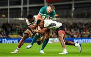 23 November 2024; Stuart McCloskey of Ireland is tackled by Fiji players Mesake Vocevoce, left, and Peni Matawalu during the Autumn Nations Series match between Ireland and Fiji at the Aviva Stadium in Dublin. Photo by Shauna Clinton/Sportsfile