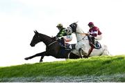 24 November 2024; Stumptown, left, with Keith Donoghue up, jumps Ruby's Double alongside Coko Beach, with Jack Kennedy up, on their way to winning the Colm Quinn BMW Risk Of Thunder Steeplechase during day two of the Punchestown Winter Festival at Punchestown Racecourse in Kildare. Photo by Seb Daly/Sportsfile