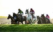 24 November 2024; Stumptown, left, with Keith Donoghue up, jumps Ruby's Double alongside Coko Beach, with Jack Kennedy up, on their way to winning the Colm Quinn BMW Risk Of Thunder Steeplechase during day two of the Punchestown Winter Festival at Punchestown Racecourse in Kildare. Photo by Seb Daly/Sportsfile