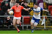 24 November 2024; Jack Conlon of Clann Éireann in action against Niall Kelly of Errigal Ciaran during the AIB Ulster GAA Senior Club Football Championship semi-final match between Clann Éireann and Errigal Ciaran at Páirc Esler in Newry, Down. Photo by Stephen Marken/Sportsfile
