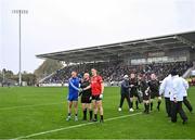 27 October 2024; Referee Brendan Cawley with team captains Eoin Doyle of Naas and Mick O'Grady of Celbridge before the Kildare County Senior Club Football Championship final match between Celbridge and Naas at Cedral St Conleth's Park in Newbridge, Kildare. Photo by Piaras Ó Mídheach/Sportsfile