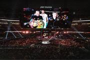 15 November 2024; Katie Taylor accompanied by manager Brian Peters, left, and promoter Eddie Hearn make their way to the ring for her undisputed super lightweight championship fight with Amanda Serrano at AT&T Stadium in Arlington, Texas, USA. Photo by Stephen McCarthy/Sportsfile