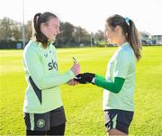 26 November 2024; Goalkeeper Courtney Brosnan is presented with her Senior Women's International Player of the Year award by Kyra Carusa, right, after a Republic of Ireland women training session at the FAI National Training Centre in Abbotstown, Dublin. Photo by Stephen McCarthy/Sportsfile