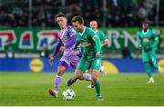28 November 2024; Matthias Seidl of SK Rapid in action against Darragh Burns of Shamrock Rovers during the UEFA Conference League 2024/25 league phase match between SK Rapid and Shamrock Rovers at the Allianz Stadion in Vienna, Austria. Photo by Tom Seiss/Sportsfile