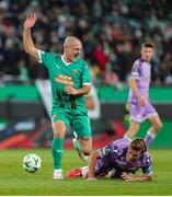 28 November 2024; Lukas Grgic of SK Rapid in action against Daniel Cleary of Shamrock Rovers during the UEFA Conference League 2024/25 league phase match between SK Rapid and Shamrock Rovers at the Allianz Stadion in Vienna, Austria. Photo by Tom Seiss/Sportsfile