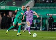 28 November 2024; Johnny Kenny of Shamrock Rovers in action against Nenad Cvetkovic of SK Rapid during the UEFA Conference League 2024/25 league phase match between SK Rapid and Shamrock Rovers at the Allianz Stadion in Vienna, Austria. Photo by Tom Seiss/Sportsfile