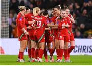29 November 2024; Lily Woodham of Wales, second from right, celebrates with teammates after scoring their side's first goal during the UEFA Women's EURO 2025 Play-off Round Two first leg match between Wales and Republic of Ireland at Cardiff City Stadium in Wales. Photo by Stephen McCarthy/Sportsfile