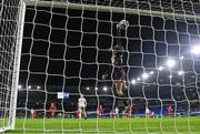 29 November 2024; Wales goalkeeper Olivia Clark fails to stop the shot of Ruesha Littlejohn of Republic of Ireland to concede her first goal during the UEFA Women's EURO 2025 Play-off Round Two first leg match between Wales and Republic of Ireland at Cardiff City Stadium in Wales. Photo by Stephen McCarthy/Sportsfile